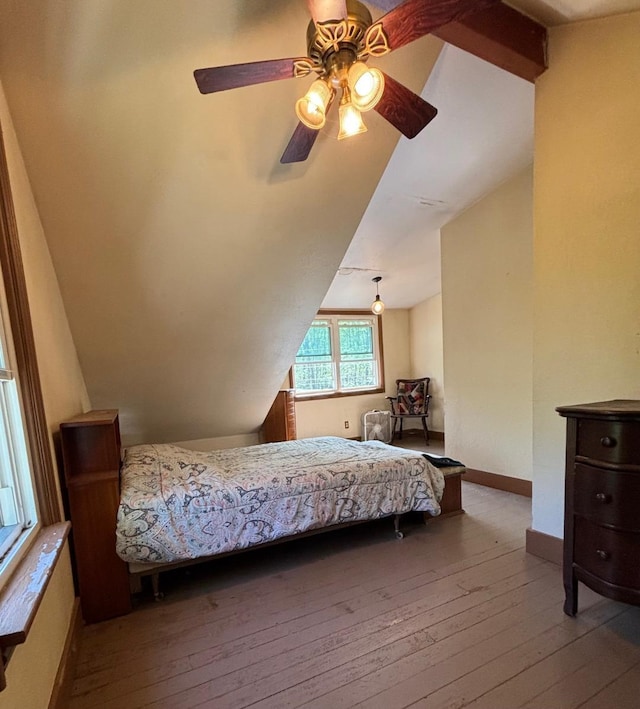 6056 Clary Ct, Sawyer, MI 49125 - bedroom with vaulted ceiling, wood-type flooring, a ceiling fan, and baseboards