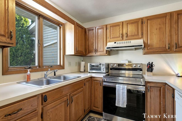940 Laketown Dr, Holland, MI 49423 - kitchen featuring stainless steel range with electric stovetop, a sink, ventilation hood, and brown cabinets