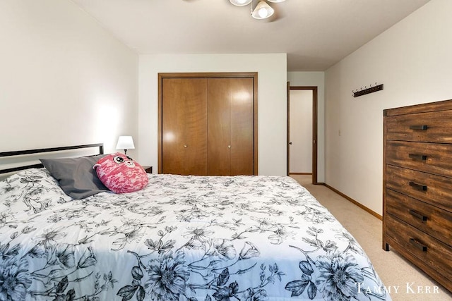 940 Laketown Dr, Holland, MI 49423 - bedroom featuring light colored carpet, a closet, and baseboards