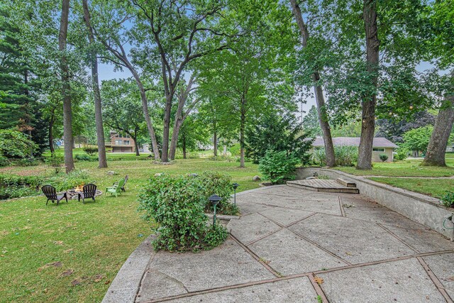 1514 Ferndale Blvd, Niles, MI 49120 - view of green lawn with a fire pit and view of wooded area