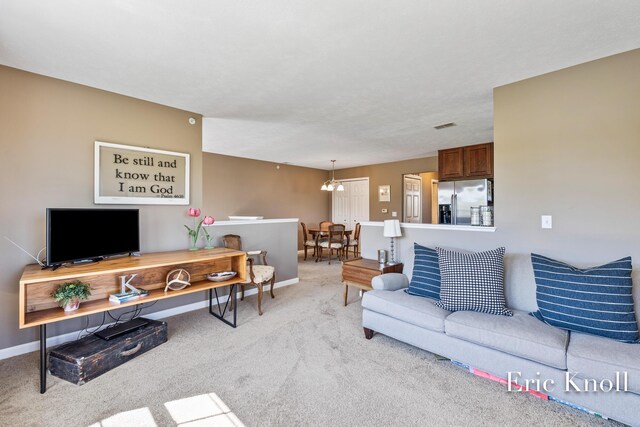 4865 Rapid River Ave SW, Wyoming, MI 49418 - living area with light colored carpet and baseboards