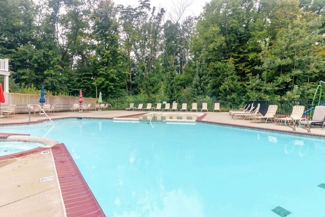 4865 Rapid River Ave SW, Wyoming, MI 49418 - community pool featuring a patio