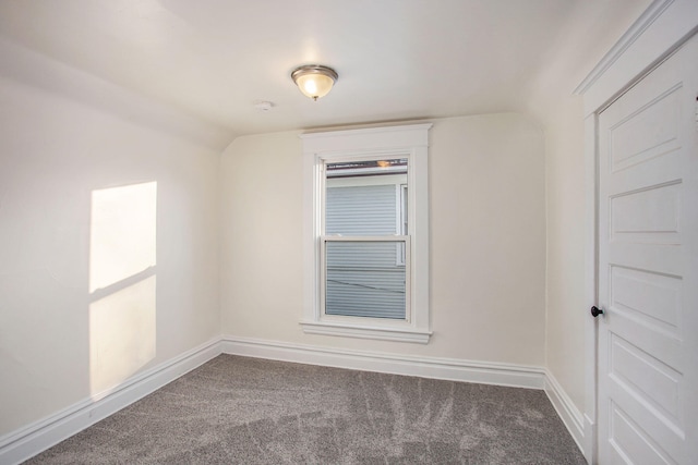 918 Kalamazoo Ave SE, Grand Rapids, MI 49507 - unfurnished room with carpet floors, baseboards, and lofted ceiling