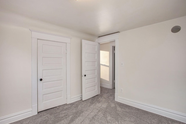 918 Kalamazoo Ave SE, Grand Rapids, MI 49507 - unfurnished bedroom with carpet and baseboards