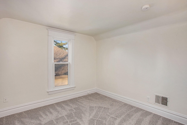 918 Kalamazoo Ave SE, Grand Rapids, MI 49507 - unfurnished room with lofted ceiling, a smoke detector, carpet flooring, and baseboards