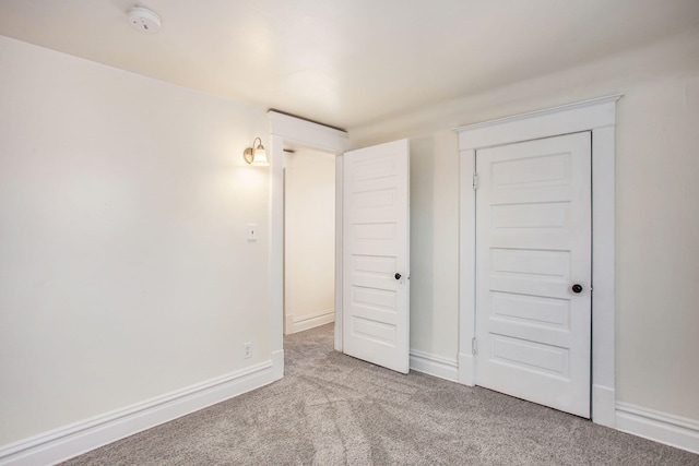918 Kalamazoo Ave SE, Grand Rapids, MI 49507 - unfurnished bedroom featuring carpet flooring and baseboards