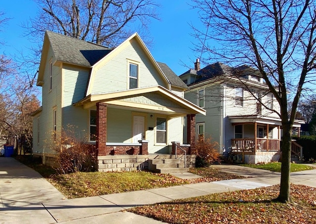 918 Kalamazoo Ave SE, Grand Rapids, MI 49507 - view of front of property with a porch, brick siding, and a shingled roof