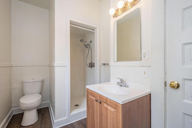 918 Kalamazoo Ave SE, Grand Rapids, MI 49507 - full bathroom featuring toilet, wood finished floors, a shower stall, and vanity