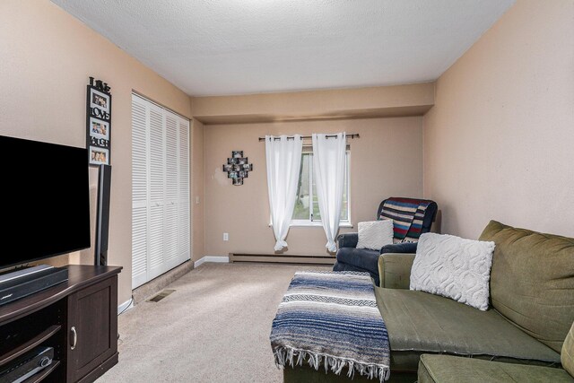 13195 Rainbow Dr, Gregory, MI 48137 - living area with a baseboard heating unit, light colored carpet, and baseboards