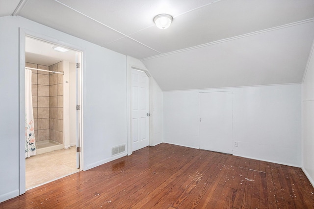 7566 Red Arrow Hwy, Stevensville, MI 49127 - additional living space with lofted ceiling and wood-type flooring