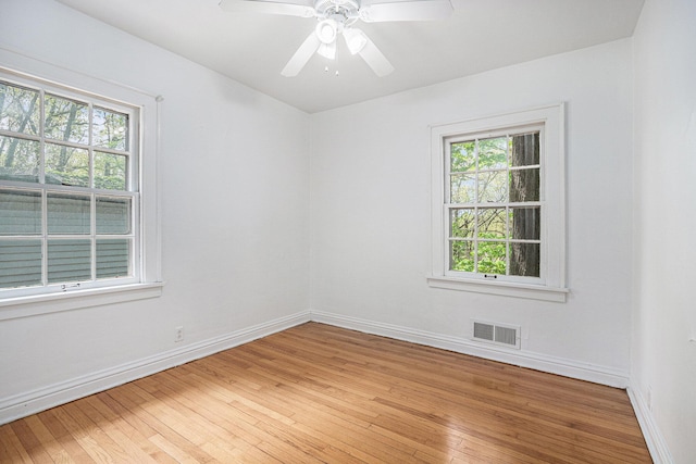 7566 Red Arrow Hwy, Stevensville, MI 49127 - spare room with plenty of natural light, light wood-style flooring, baseboards, and ceiling fan