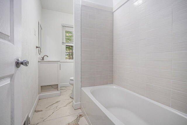 7566 Red Arrow Hwy, Stevensville, MI 49127 - full bathroom featuring marble finish flooring, baseboards, toilet, a bath, and a shower