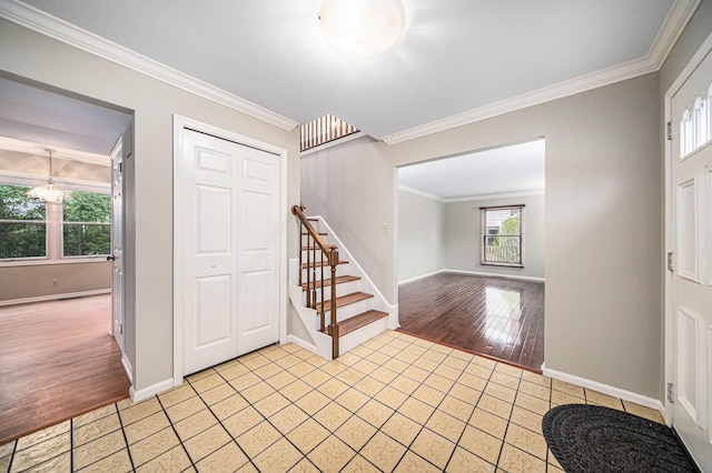3630 Charter Pl, Ann Arbor, MI 48105 - foyer entrance with stairway, ornamental molding, light wood finished floors, and baseboards