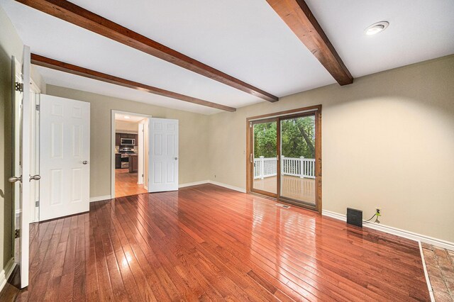 3630 Charter Pl, Ann Arbor, MI 48105 - spare room with beamed ceiling, wood-type flooring, and baseboards