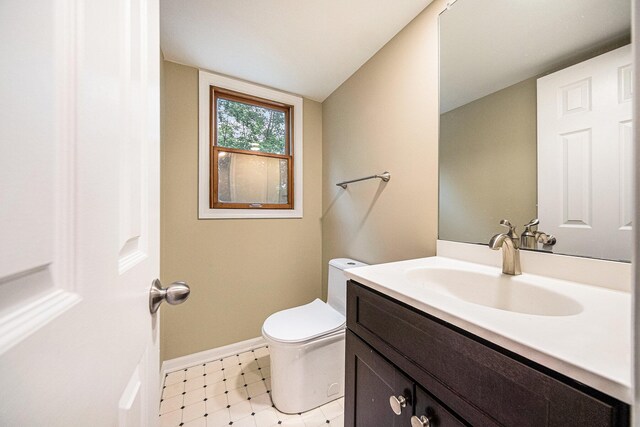 3630 Charter Pl, Ann Arbor, MI 48105 - bathroom featuring tile patterned floors, toilet, baseboards, and vanity