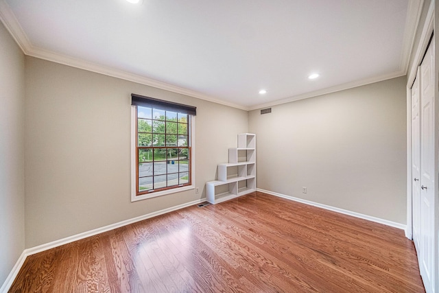 3630 Charter Pl, Ann Arbor, MI 48105 - spare room featuring wood finished floors, baseboards, ornamental molding, and recessed lighting