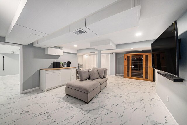 3630 Charter Pl, Ann Arbor, MI 48105 - living room with baseboards, light marble finish floors, and recessed lighting