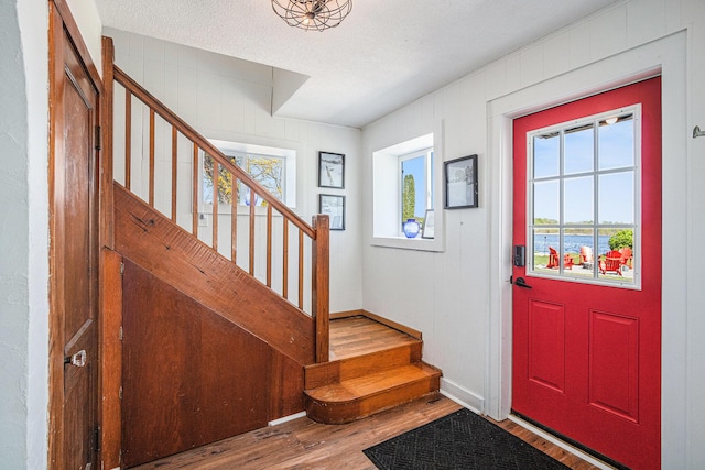 8700 E Napier Ave, Benton Harbor, MI 49022 - foyer with wood finished floors, stairs, and baseboards