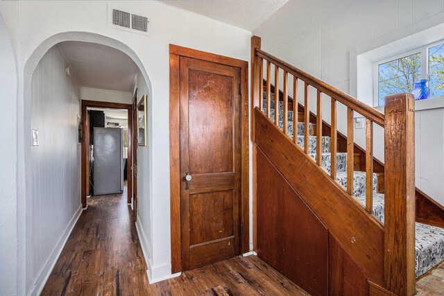 8700 E Napier Ave, Benton Harbor, MI 49022 - stairway featuring hardwood / wood-style flooring and arched walkways