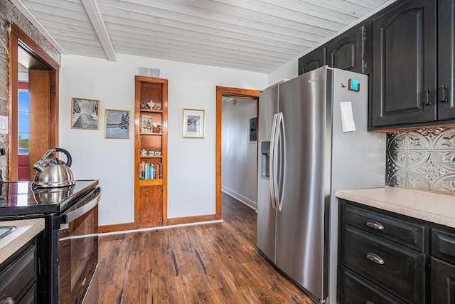 8700 E Napier Ave, Benton Harbor, MI 49022 - kitchen with stainless steel fridge, dark cabinets, electric range oven, light countertops, and beamed ceiling