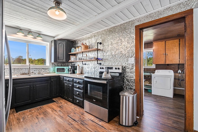 8700 E Napier Ave, Benton Harbor, MI 49022 - kitchen featuring appliances with stainless steel finishes, washer / dryer, a sink, backsplash, and wood finished floors
