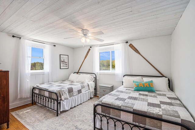 8700 E Napier Ave, Benton Harbor, MI 49022 - bedroom featuring wooden ceiling, light wood-style flooring, and a ceiling fan