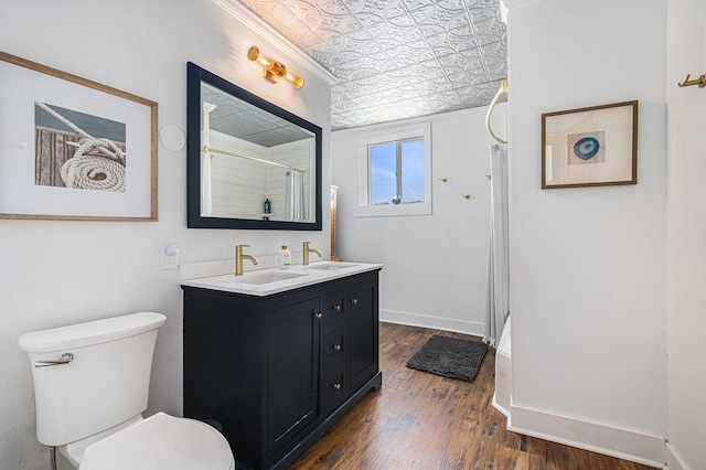 8700 E Napier Ave, Benton Harbor, MI 49022 - full bath with an ornate ceiling, a shower, wood finished floors, toilet, and double vanity