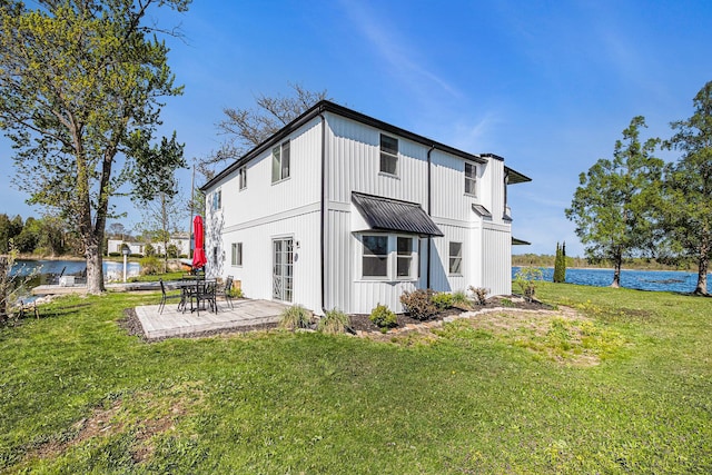 8700 E Napier Ave, Benton Harbor, MI 49022 - rear view of house with a patio area, a water view, and a yard