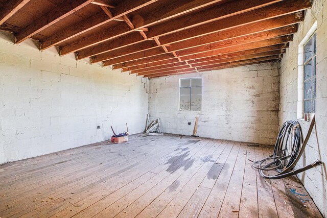8700 E Napier Ave, Benton Harbor, MI 49022 - miscellaneous room featuring wood-type flooring and concrete block wall