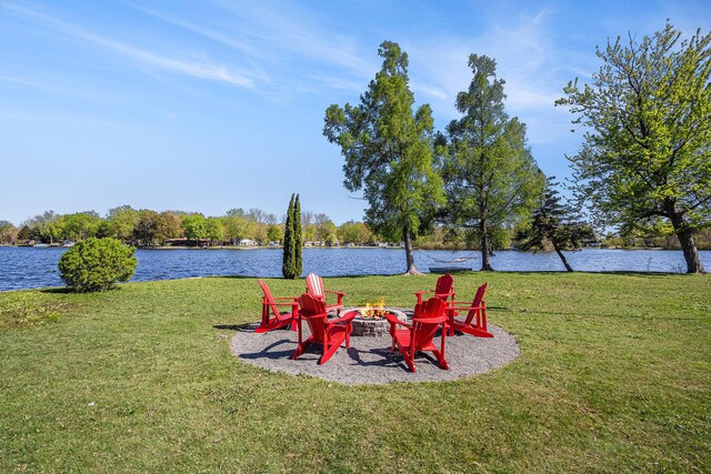 8700 E Napier Ave, Benton Harbor, MI 49022 - view of green lawn featuring an outdoor fire pit and a water view