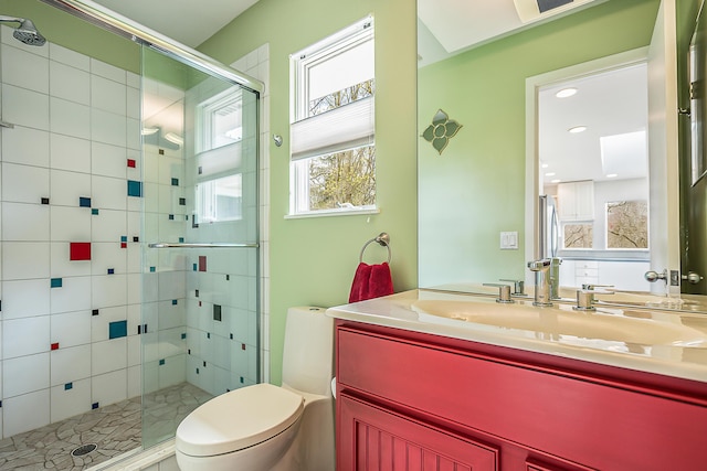 2277 W Huron River Dr, Ann Arbor, MI 48103 - full bath with a shower stall, toilet, vanity, and recessed lighting