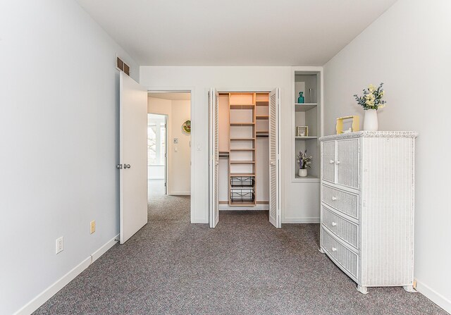 2277 W Huron River Dr, Ann Arbor, MI 48103 - bedroom featuring carpet floors, baseboards, and a closet