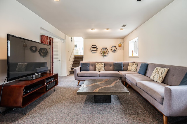 2277 W Huron River Dr, Ann Arbor, MI 48103 - living area with carpet floors, stairway, and healthy amount of natural light