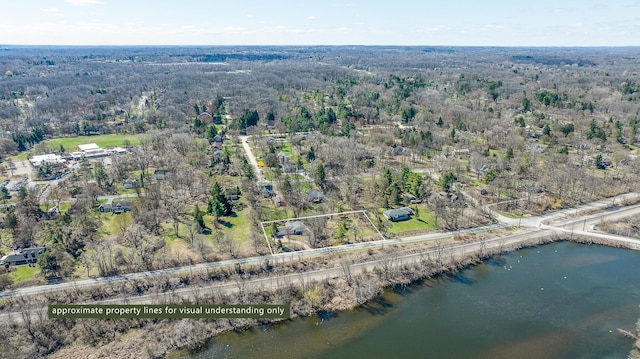 2277 W Huron River Dr, Ann Arbor, MI 48103 - aerial view of property and surrounding area with a heavily wooded area, property boundaries highlighted, and a nearby body of water