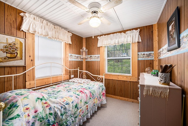 3309 Dumont Lake Dr, Allegan, MI 49010 - carpeted bedroom with wood walls and ceiling fan