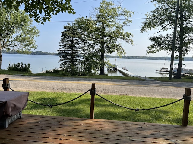 6439 E Sugar Grove Rd, Fountain, MI 49410 - wooden terrace featuring a water view and a lawn