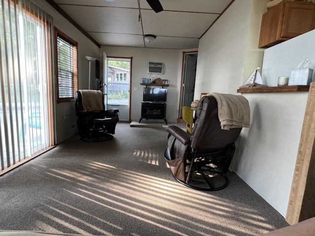 6439 E Sugar Grove Rd, Fountain, MI 49410 - living area with carpet, an AC wall unit, and ceiling fan