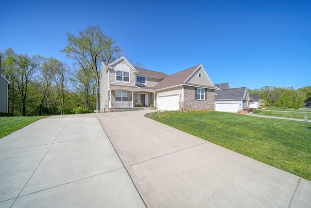 10478 River Edge Rd, Saline, MI 48176 - view of front of property featuring a front yard, concrete driveway, brick siding, an attached garage, and covered porch