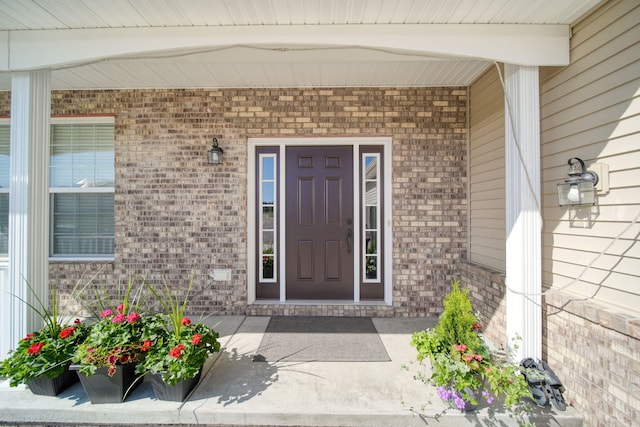 10478 River Edge Rd, Saline, MI 48176 - view of exterior entry featuring brick siding and a porch