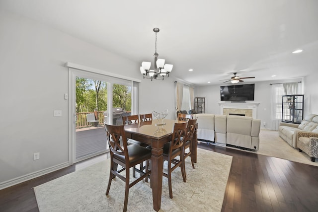 10478 River Edge Rd, Saline, MI 48176 - dining room featuring recessed lighting, healthy amount of natural light, a chandelier, a ceiling fan, and dark wood-type flooring