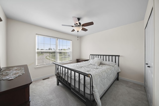 10478 River Edge Rd, Saline, MI 48176 - bedroom with carpet flooring, a closet, baseboards, and a ceiling fan