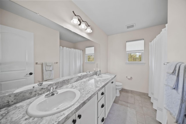 10478 River Edge Rd, Saline, MI 48176 - full bathroom featuring baseboards, toilet, double vanity, and tile patterned floors