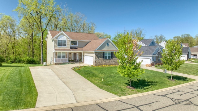 10478 River Edge Rd, Saline, MI 48176 - traditional-style home featuring driveway, a front lawn, covered porch, and an attached garage