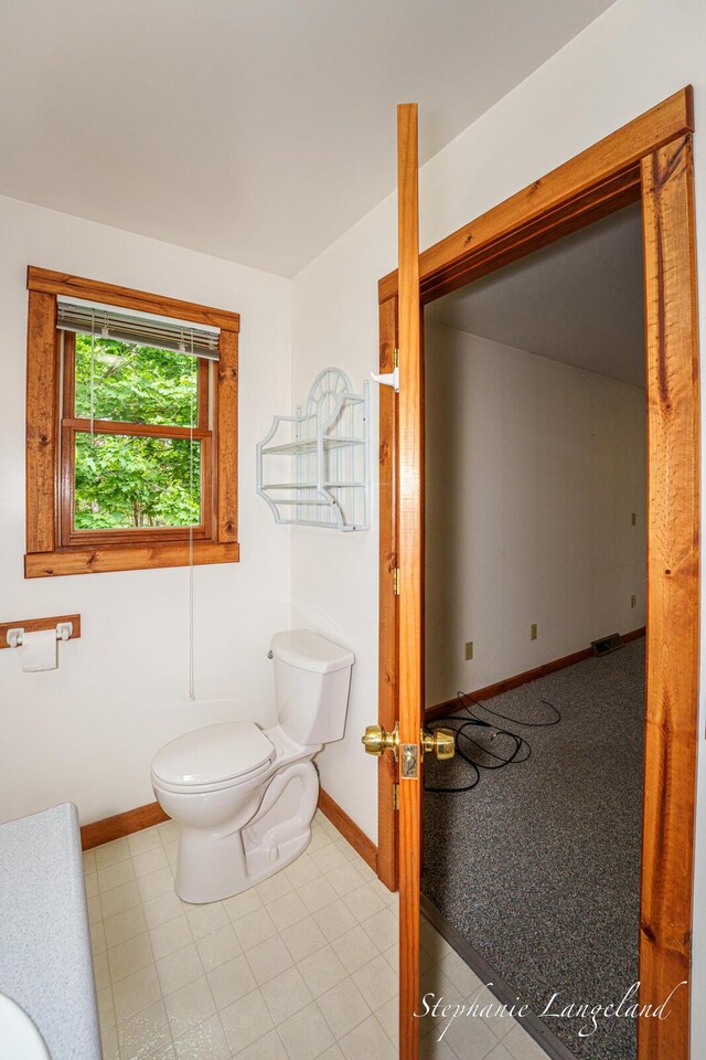 16913 Penny Ave NE, Sand Lake, MI 49343 - bathroom with toilet and baseboards