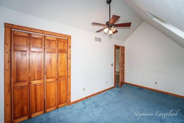 16913 Penny Ave NE, Sand Lake, MI 49343 - unfurnished bedroom with vaulted ceiling, carpet, baseboards, and a ceiling fan
