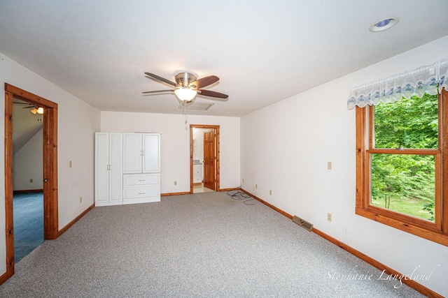 16913 Penny Ave NE, Sand Lake, MI 49343 - unfurnished bedroom with baseboards, carpet flooring, and ceiling fan