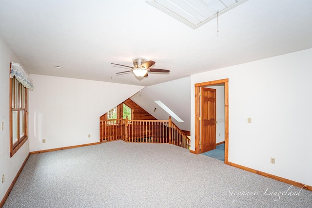 16913 Penny Ave NE, Sand Lake, MI 49343 - bonus room with attic access, carpet, a ceiling fan, baseboards, and lofted ceiling