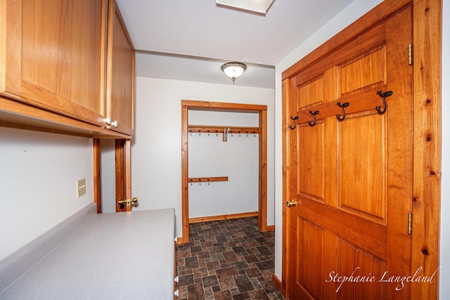 16913 Penny Ave NE, Sand Lake, MI 49343 - hallway featuring stone finish flooring