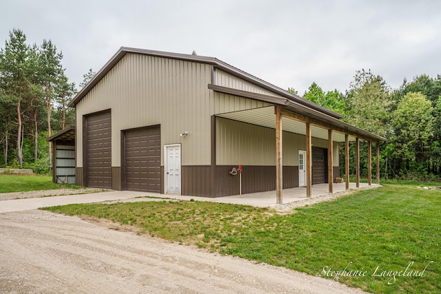 16913 Penny Ave NE, Sand Lake, MI 49343 - garage with a garage and driveway