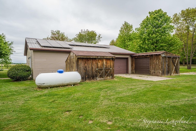 16913 Penny Ave NE, Sand Lake, MI 49343 - view of side of property with a lawn, an outbuilding, and a detached garage